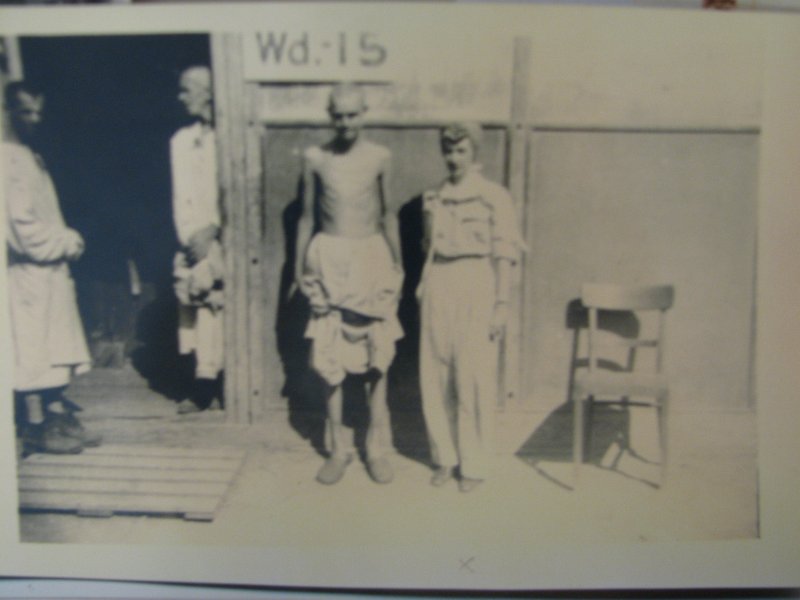 Dave0670.jpg - Honey Kaiser (far right) work at Dachau following its liberation.