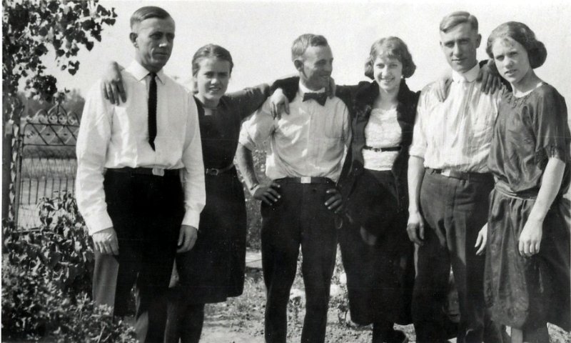 image018a.jpg - 1922 "My maternal grandmother, Laura Isabel (nee Kaiser) Zeltinger, had 12 siblings.This photo was taken at their sibling Freddy's funeral. Freddy was killed in a hunting accident. Shown are (L to R) George Kaiser, Ruth "Toots" Kaiser, Walter"Kid" Kaiser ("Kid" was short for "Billy the Kid" - yeah, I know, but he is not "the" BTK), Helen "Honey" Kaiser, Emil "Doc" Kaiser, and Bertha "Granny" Kaiser.Look closely down on the ground between Emil's legs.There's Charles Kaiser. He was just a youngster then. Mom calls him Dirty Uncle Charlie." - DJM Jr