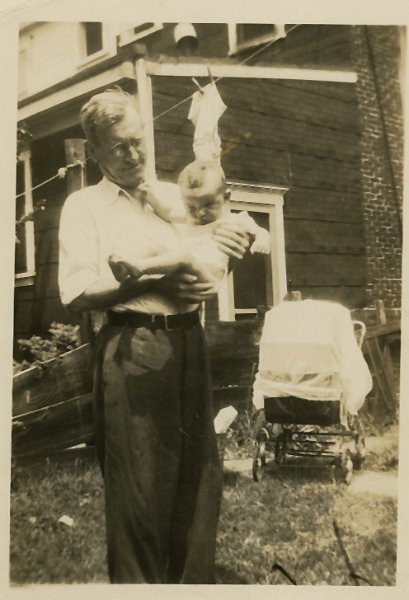 1945prints036.jpg - Per Uncle Joe Maloney, "This is a picture of my father [James Joseph Maloney, Sr.] holding a baby. The baby is probably my nephew John Mahon (my sister Ann's son).