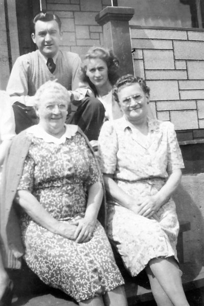 1946prints154.jpg - 1946. David J. Maloney, Sr. pictured in Linwood, PA with unknown ladies. In 1946 he had brought his wife, Jane, back East to live.