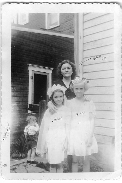 1946prints163.jpg - Ann (Maloney) Mahon with daughters Joan and Little Ann. Son, Johnny, cries in the background. C. 1946.