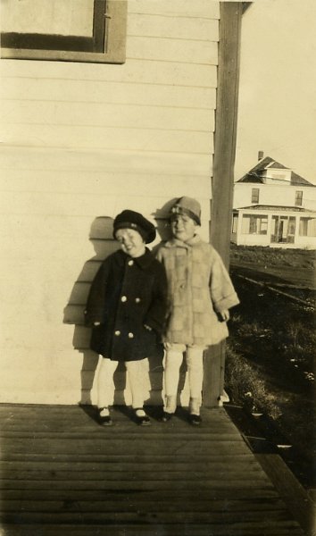 1927prints001.jpg - 1927. "This image was taken in 1927. It shows (l to r) Miriam ""Pat"" Zeltinger, my aunt, standing next to her older sister (my Mom), Dorothy Janette ""Toots"" Zeltinger. The back of the photo is marked ""Pat & Toots / Flasher N.D. / early 1920s"".The photo is marked with an oval inside of which is printed ""Quality Kodak Finishing / Hoskins-Meyer / Jun 15 1927 / The Home of KFVR / Bismarck, N.D."" - DJM Jr