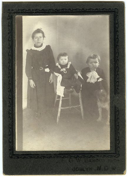 jz_005.jpg - Unknown children and dog. Photographer is noted at the bottom as "G. W. Barous / Joblyn, N.D."