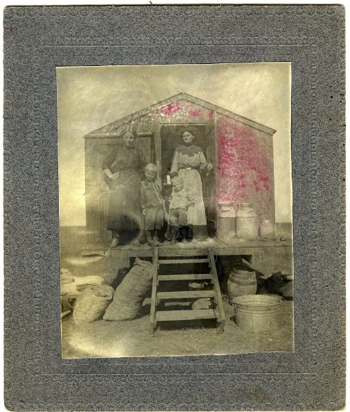 jz_030.jpg - Field cook wagon. Woman on right appears to be Katie Zeltinger. Same matting as the next two images - one of Matt Zeltinger with two unknown boys, and one of Katie Zeltinger with two unknown girls.