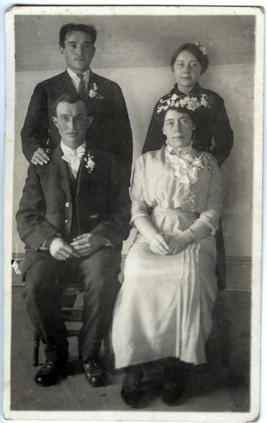 jz_084.jpg - Katie (Ethen) Zeltinger's brother, Joseph Ethen (seated) on his wedding day; his bride seated next to him is Mary F. "Mamie" Fuchs. (Note that Mamie's Aunt (another Mary Fuchs) married Joseph's brother, Henry Louis Ethen.) The woman standing behind Maime is one of her her sisters (a Fuchs); the man standing behind Joseph is unknown.