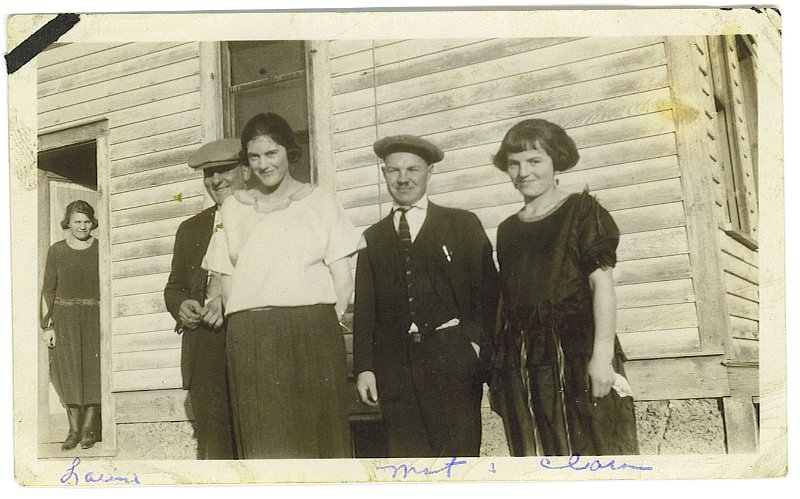 ldz_15.jpg - Inscribed on reverse, "Matt Zeltinger, Clara Ahman and some of Matt's friends." Louise Zeltinger stands in the doorway at left.