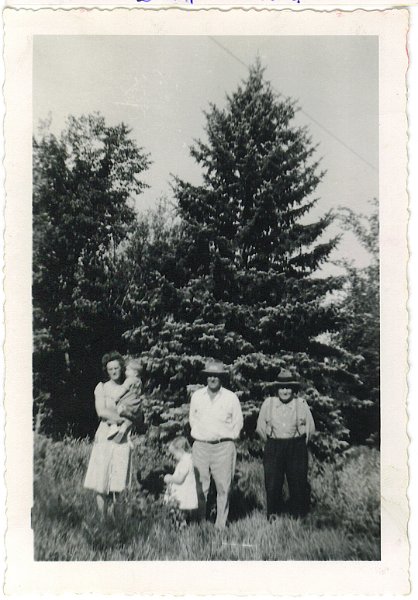 ldz_33.jpg - On Ignatius and Katie Zeltinger farm near Tolley, ND; Eunice and Jerry, John and Rae Jeane, Ignatius Zeltinger; 1946