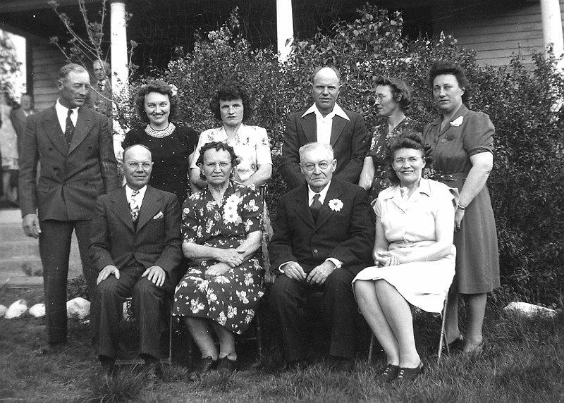 zeltinger052.jpg - 50th wedding anniversary of Ignatius and Katie Zeltinger (seated center), June 1, 1946; Eight Zeltinger children -  seated to far left is Matt and to the far right is Louise; standing L to R: Frank, Loretta (Mrs. Paul Shores), Clara (Mrs. Leander "Lee" Ahmann), Edward, Lena (Mrs. Clem Resch), Anne (Mrs. Lloyd Owen).