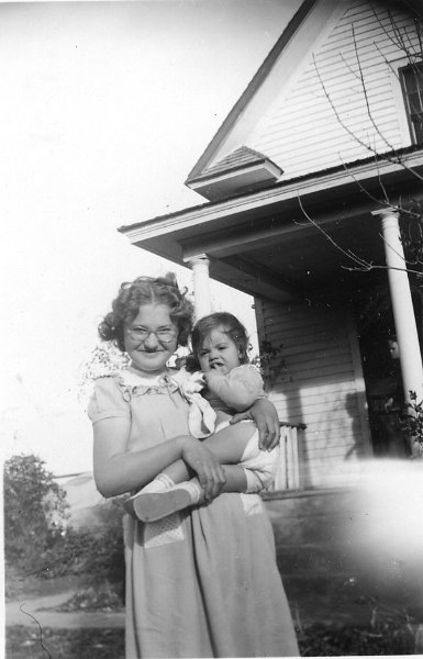 zeltinger056.jpg - Baby Katherine Maloney with Rita Resch (Lena's daughter); Oct. or Nov. 1948, on the Ignatius and Katie Zeltinger farm near Tolley, ND.