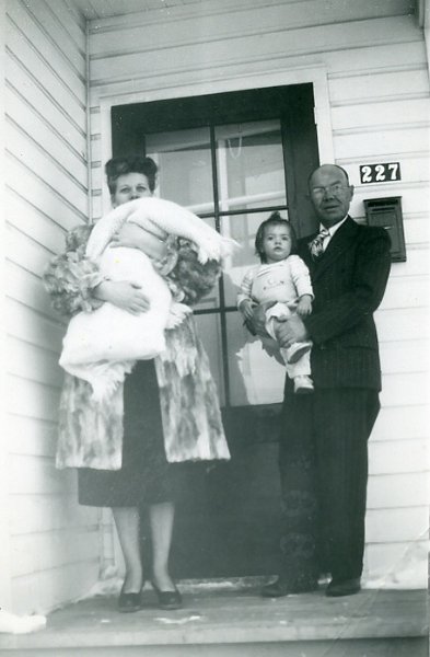 zeltinger071.jpg - Laura and Matt Zeltinger in Riverdale, ND (227 7th St.) for grandson David J. Maloney Jr's  baptism. Laura holds baby David while Matt holds David's sister Katherine; Jan 30, 1949.