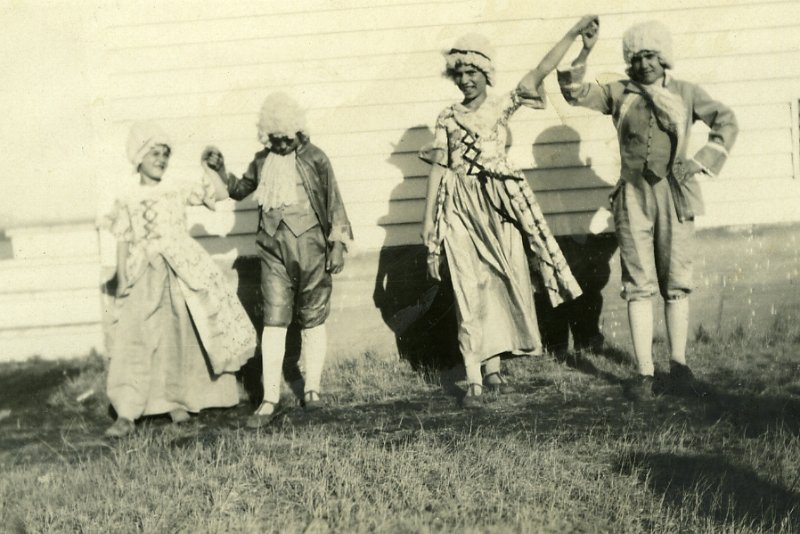 zeltinger097.jpg - Pat Zeltinger 2nd from left. Dorothy "Jane" Zeltinger 2nd from right. On reverse written by theirmother Laura: "Pat was mad and didn't want to dress for the pictures. Notice how she hangs her head. I made the the outfits and wigs." c. 1935.