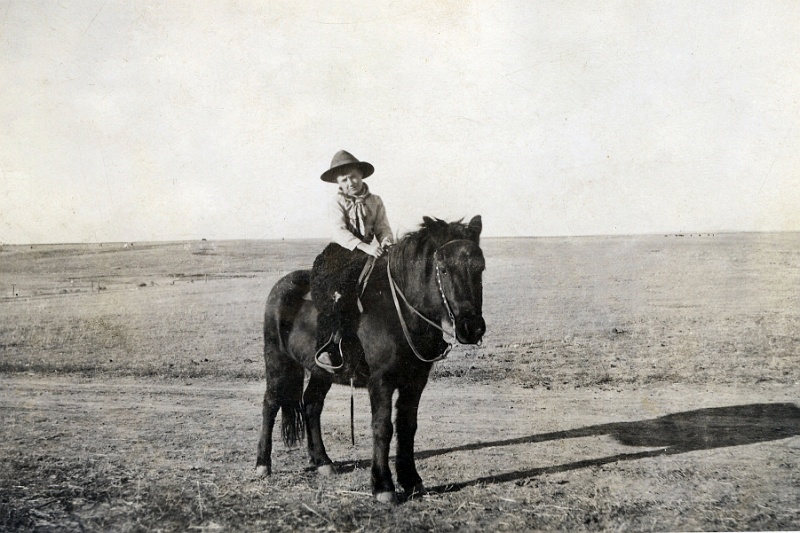 jz_091.jpg - Ernest Jensen on horseback. Inscribed on reverse "To Grandpa from Ernest Jensen." Note that Magdelena "Kate" Zeltinger (sister to Ignatius and John Zeltinger) married Jens C. "Jim" Jensen, and they lived in the Norma, ND area before homesteading in Montana in 1914.