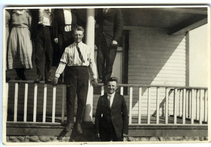 jz_100.jpg - Ignatius & Katie Zeltinger children stand on front porch of family farm just south of Tolley, ND; Matt Zeltinger on the right;  unknown brother stands to the left.