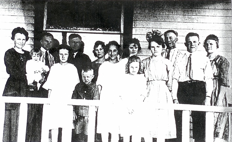 kfz_5.jpg - The Katie and Ignatius Zeltinger family: Back row - Katie holding baby Loretta, Mathias, Ignatius, Lena, Laura (Matt's wife), Frank, Louise; Front row - Marie, Edward, Ann, Otillie (died 1922), Clark, John; on Zeltinger farm, south of Tolley, ND, c. 1919. (Not shown is baby Raymond who died soon after birth in 1912.)