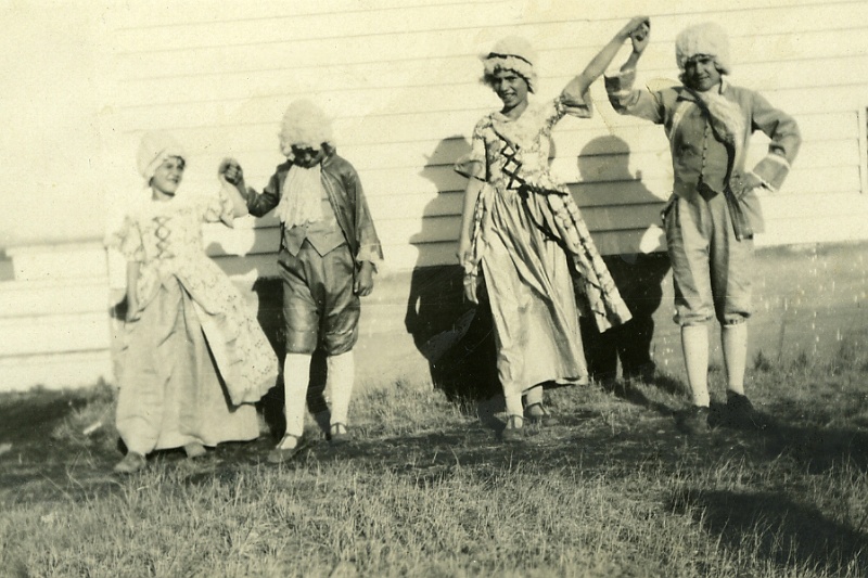 zeltinger097.jpg - Pat Zeltinger 2nd from left. Dorothy "Jane" Zeltinger 2nd from right. On reverse written by theirmother Laura: "Pat was mad and didn't want to dress for the pictures. Notice how she hangs her head. I made the the outfits and wigs." c. 1935.